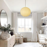Wabi Sabi silk ball pendant light installed in bright window reading nook home decor