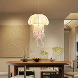 Modern jellyfish pendant light over dining table