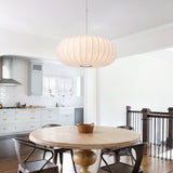 Modern wabi sabi pendant light over dining table