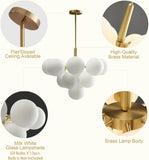 Chandelier detail: brass frame, milk white glass