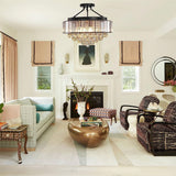 Black crystal chandelier over dining table, farmhouse industrial interior design