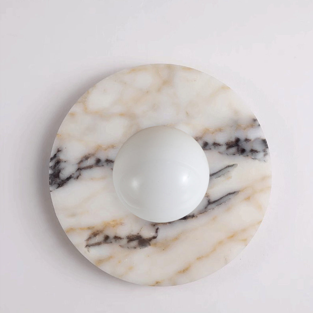 Marble wall sconce with natural stone veining