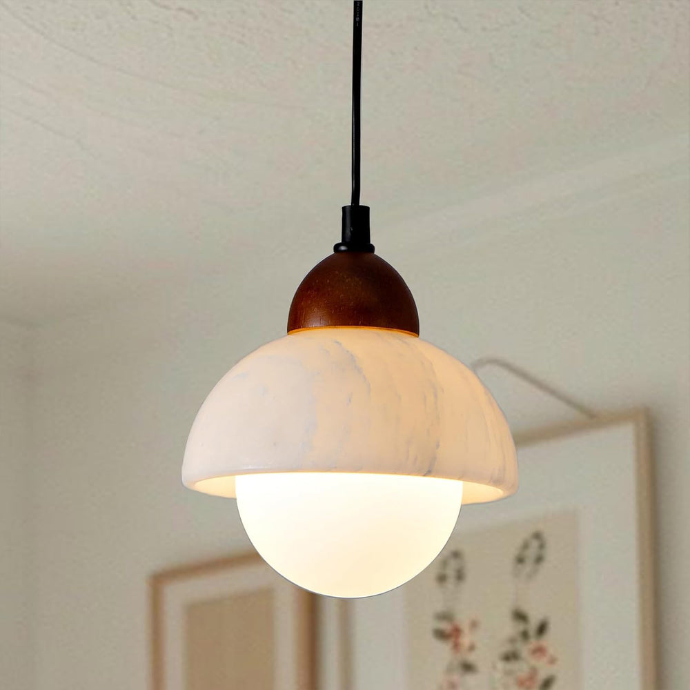 Close-up of the natural marble lampshade and wooden top of the pendant light