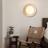 Minimalist travertine wall light fixture in neutral-toned room