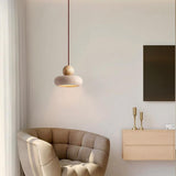 Natural wood travertine pendant light in cozy living room corner