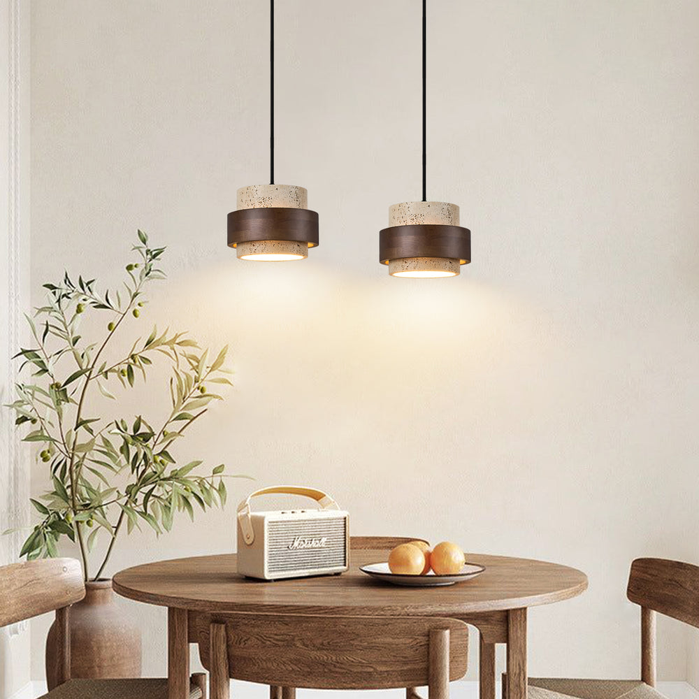 Two Yellow Travertine & Wood Pendant Lights Hanging Above a Wooden Dining Table - Rustic Organic Kitchen Lighting Idea