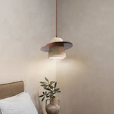 Walnut brown travertine pendant light above bed