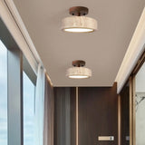 2 walnut wood travertine ceiling lights in modern hallway