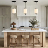 3-pack white glass pendant lights over a modern kitchen island