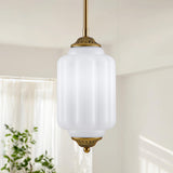 Single antique brass vertical ribbed frosted glass mini pendant light indoor white wall shot