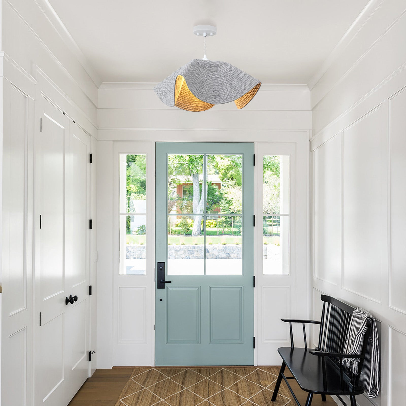 Woven pendant light in bright entryway foyer
