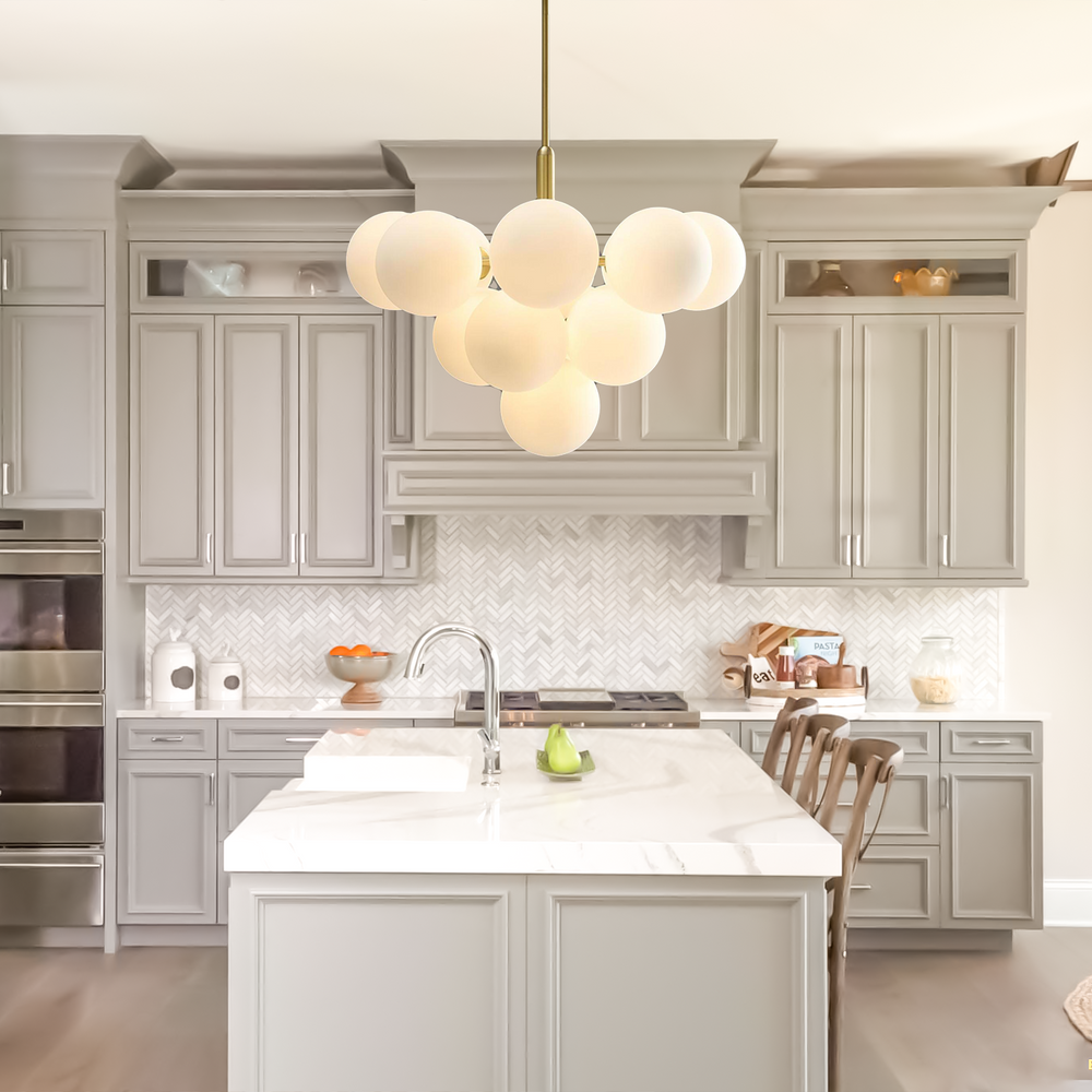 Gold bubble chandelier in light gray kitchen