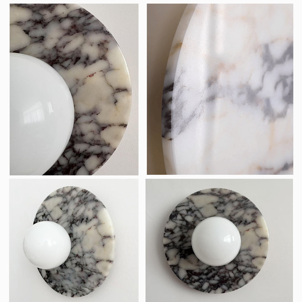 Close-up of marble textures on round wall sconces