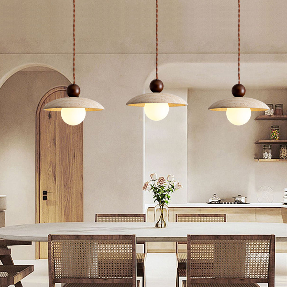 Dining room with 3 travertine pendant lights, wabi-sabi style