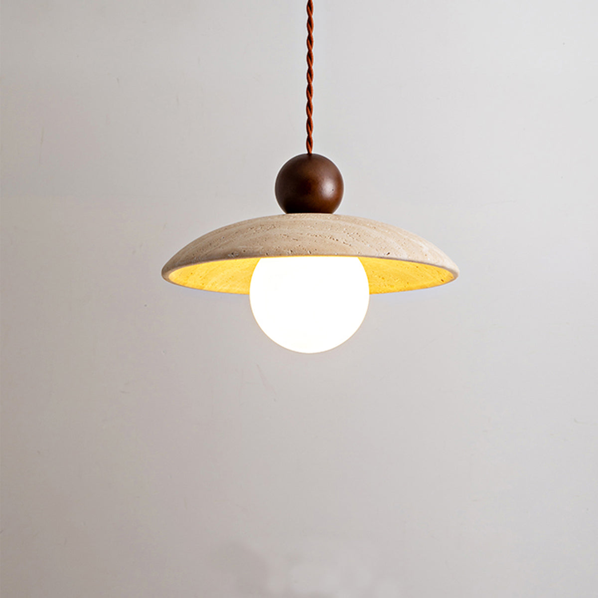 Close-up of travertine pendant light, showing stone texture