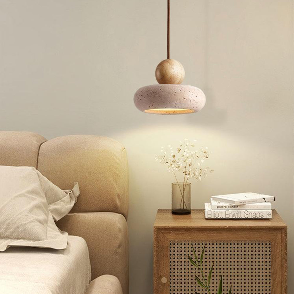 Natural travertine wood pendant light over bedside table, warm LED glow
