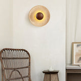 Japandi travertine wood wall sconce in neutral-toned room