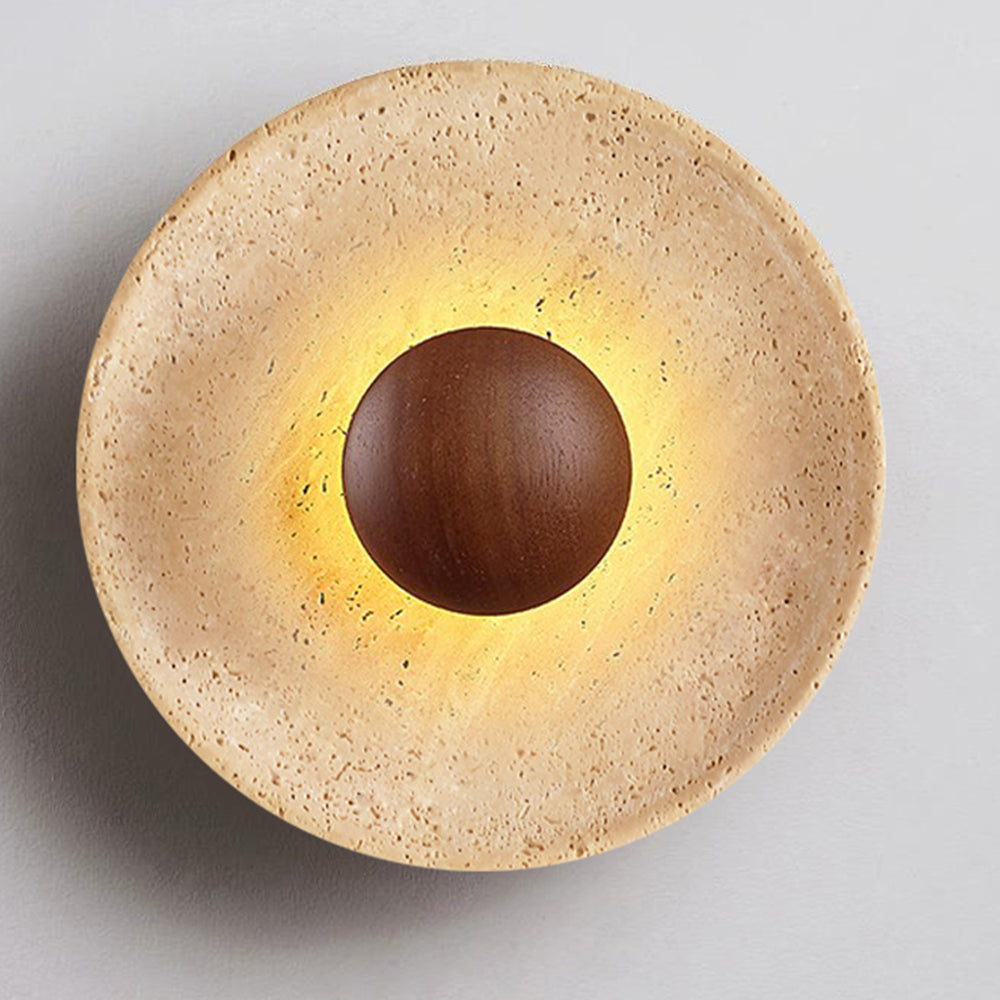 Close-up of travertine texture and wood detail on wall sconce