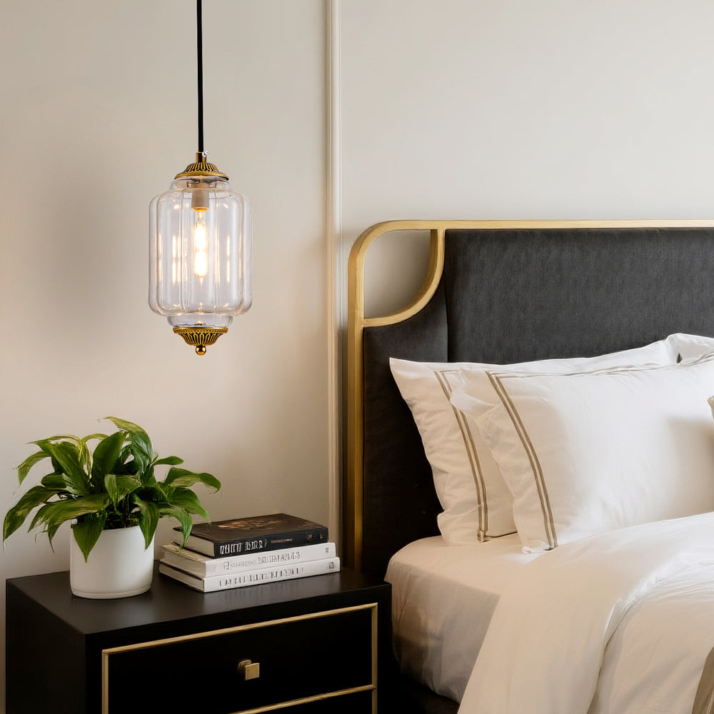 Retro clear ribbed glass pendant light hanging over bedroom bedside nightstand decor